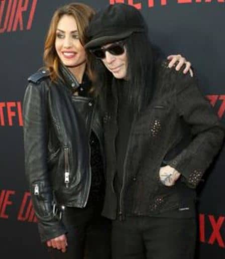 Mick Mars with his girlfriend