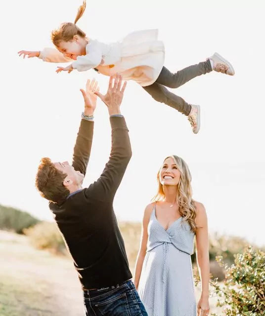 Danielle Demski with her husband and daughter