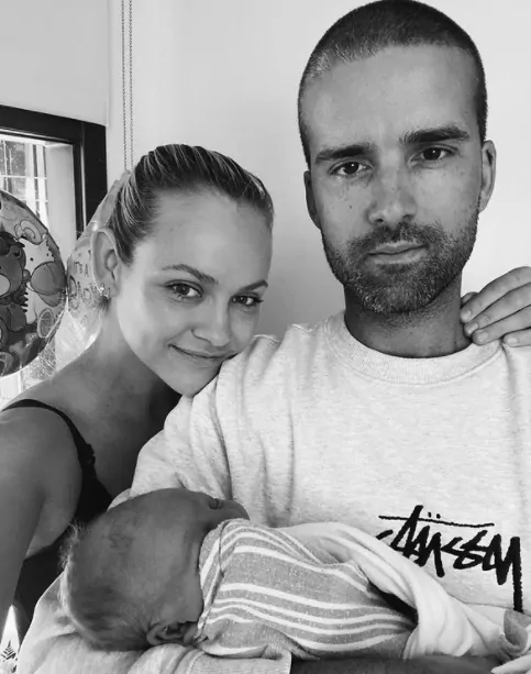Ginta Lapina with her husband and baby