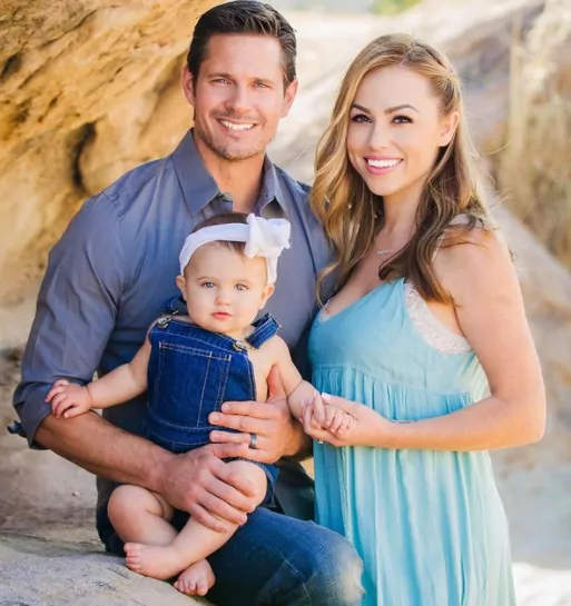 Kyle Carlson with his wife and daughter